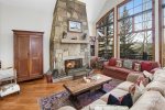 Open floor plan with stone wall fireplace